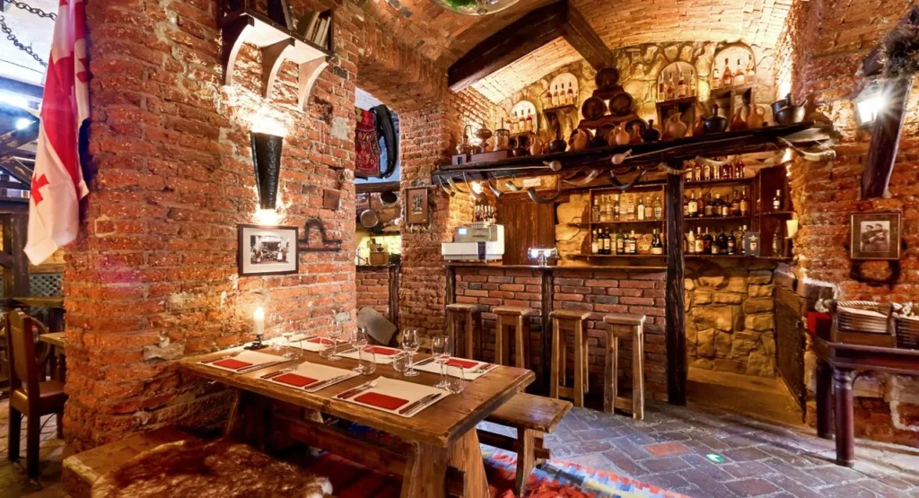 Gruzie Restaurant Prague Old Town – cozy Georgian dining near Hotel Haštal with rustic brick interior and wine bar